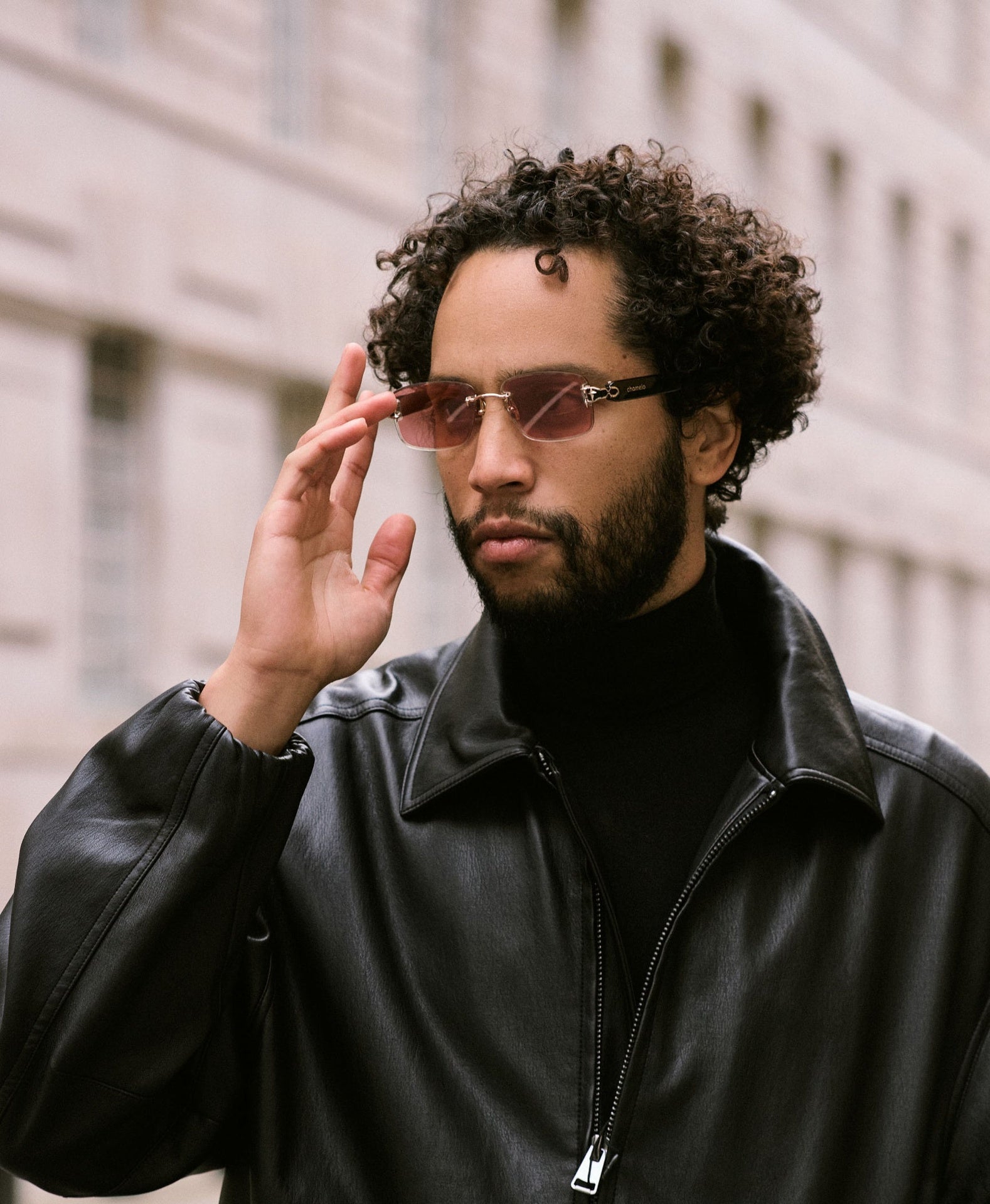 Chamelo Aura Black Smart Glasses – Lifestyle Shot Being Worn Outdoors
